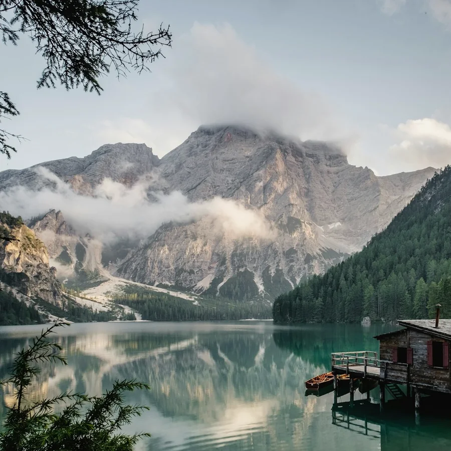 A still mountain lake reflecting the morning light
